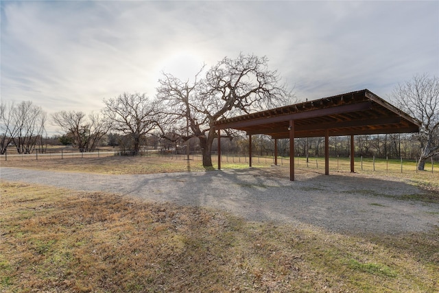 exterior space with a carport and a rural view