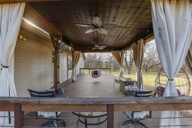 wooden deck with ceiling fan