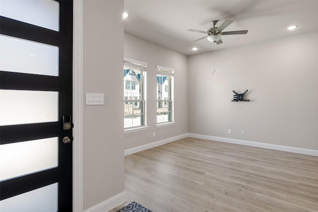 entryway with ceiling fan and light hardwood / wood-style floors