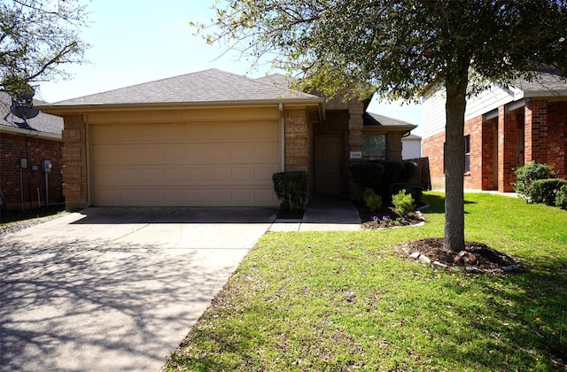 single story home featuring a garage and a front lawn