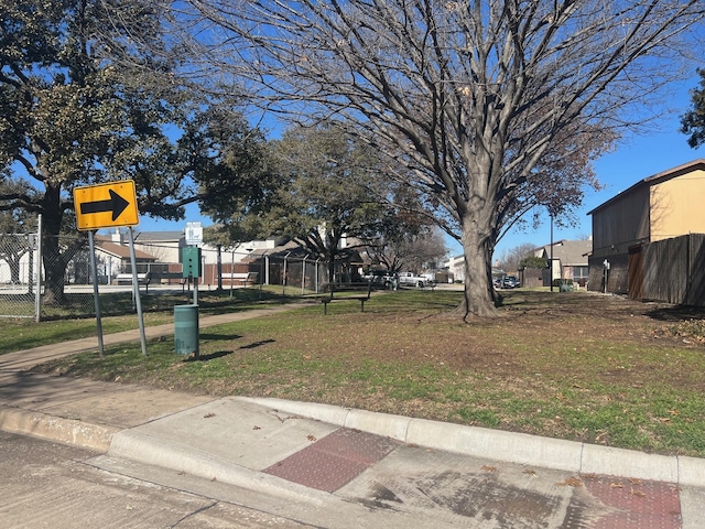 view of community with fence