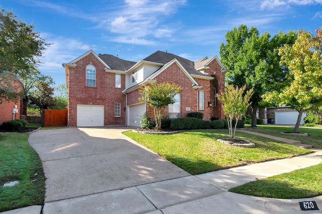 view of front property with a garage and a front yard