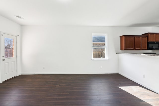 interior space with dark hardwood / wood-style floors