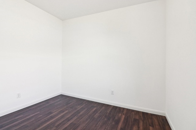 unfurnished room featuring dark hardwood / wood-style floors