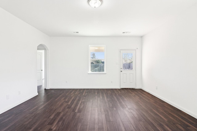 empty room featuring dark wood-type flooring