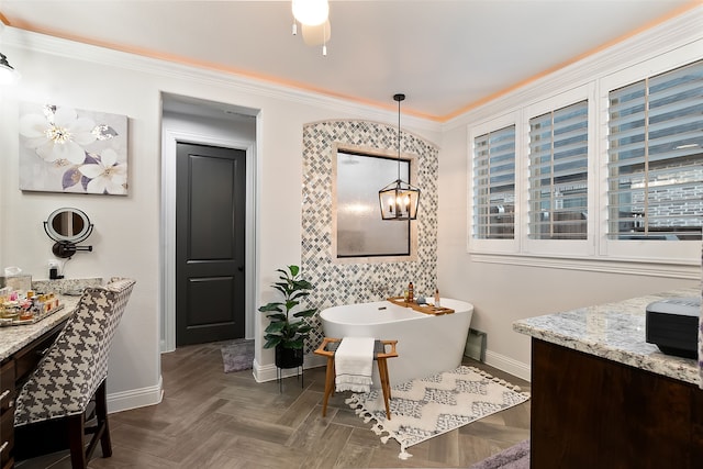 bathroom with vanity, a tub to relax in, crown molding, and parquet floors