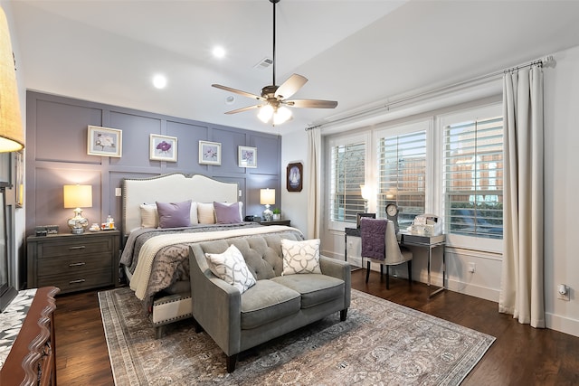 bedroom featuring lofted ceiling, dark wood-type flooring, and ceiling fan