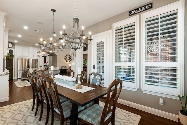 dining area featuring dark wood-type flooring