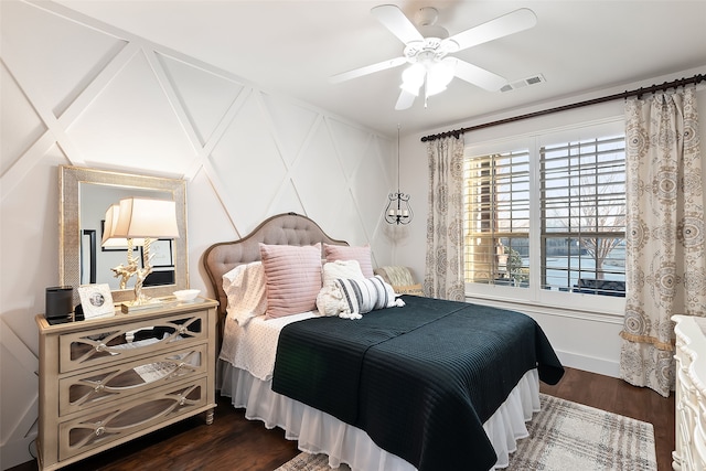 bedroom featuring dark wood-type flooring and ceiling fan