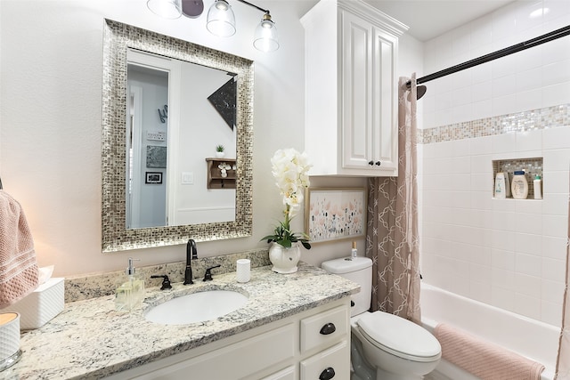 full bathroom featuring vanity, toilet, and shower / tub combo