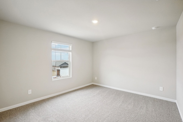 unfurnished room featuring carpet flooring