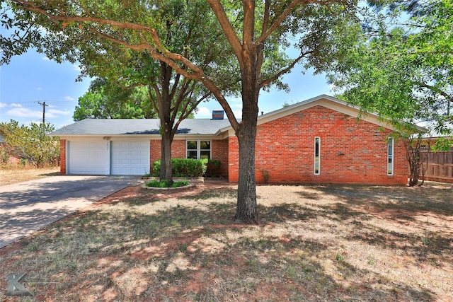 single story home featuring a garage