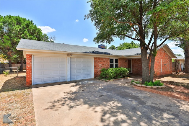 ranch-style home with a garage