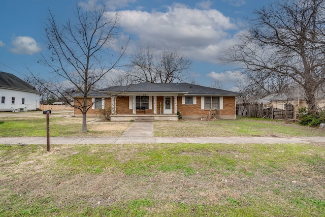 view of front of property featuring covered porch and a front yard