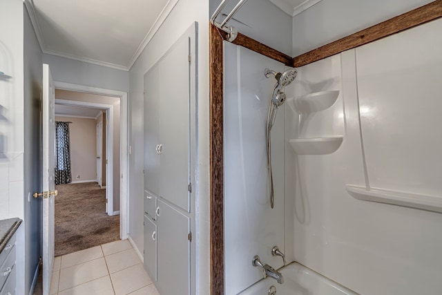 bathroom featuring tile patterned flooring, crown molding, and shower / washtub combination