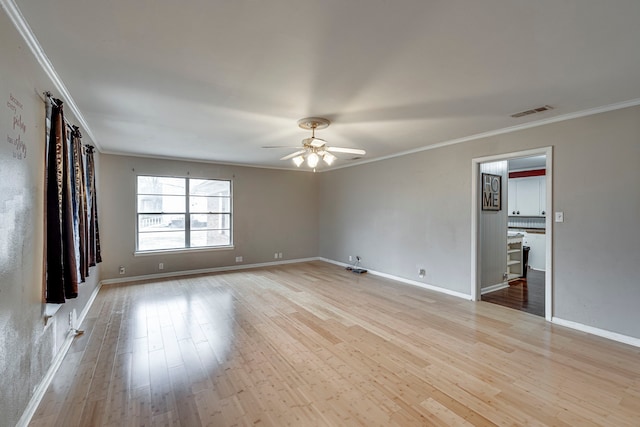 unfurnished room featuring crown molding, ceiling fan, and light hardwood / wood-style flooring