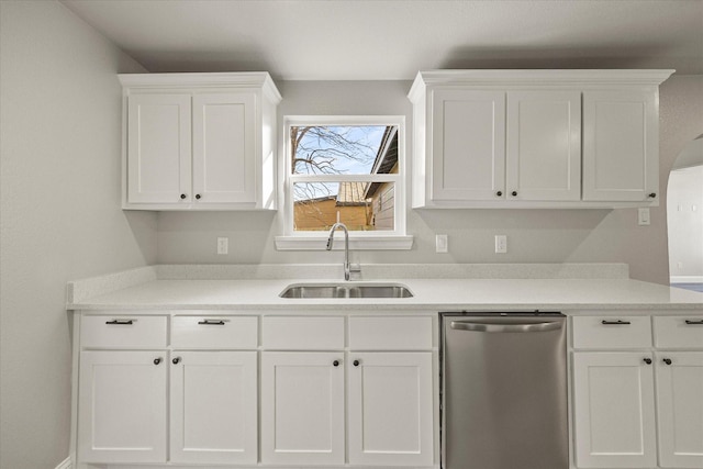 kitchen featuring white cabinetry, stainless steel dishwasher, and sink