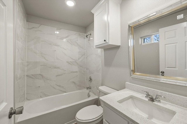 full bathroom with vanity, toilet, and tiled shower / bath