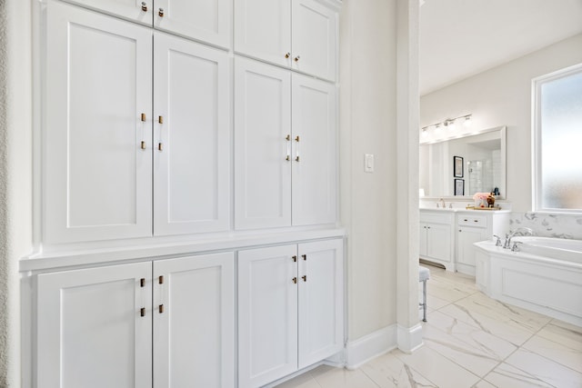 bathroom featuring vanity and a bathing tub