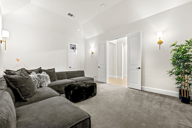 living room featuring carpet flooring and vaulted ceiling