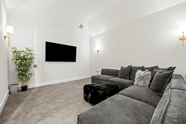 carpeted living room featuring lofted ceiling