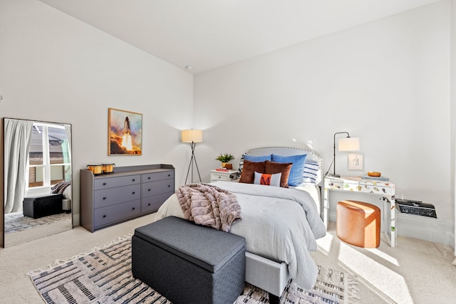 bedroom featuring light colored carpet