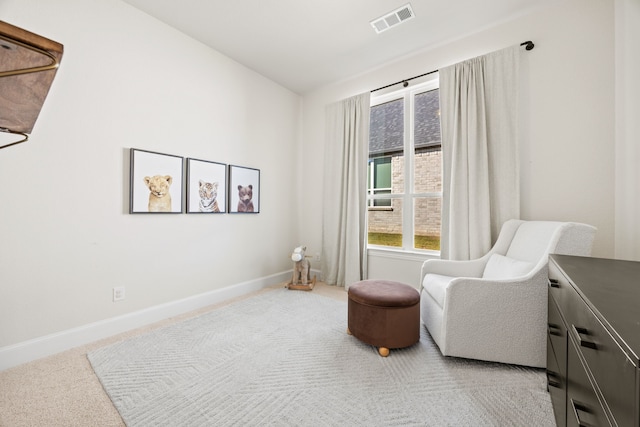 sitting room with carpet floors