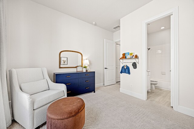 living area featuring light colored carpet