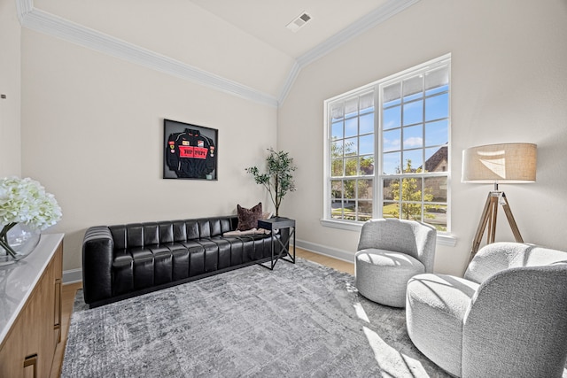 living room featuring crown molding, vaulted ceiling, and wood-type flooring