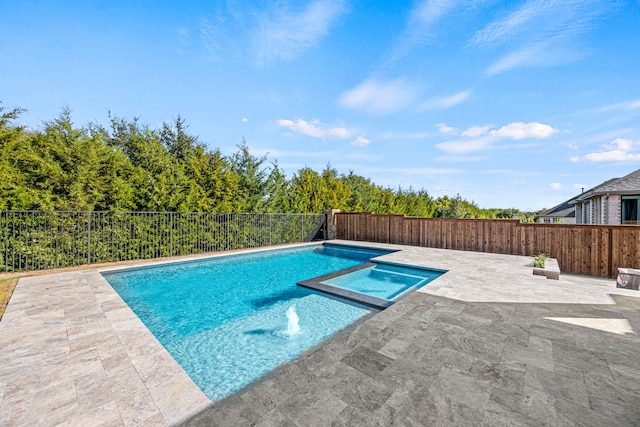 view of swimming pool featuring a patio and an in ground hot tub