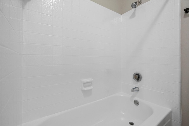 bathroom with washtub / shower combination