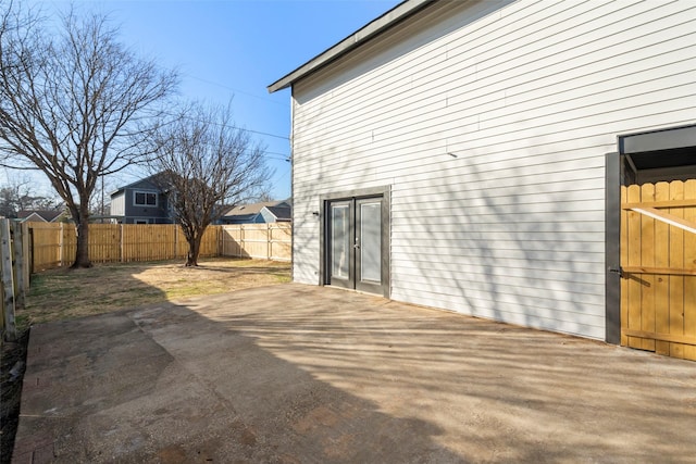 view of side of home with a patio area