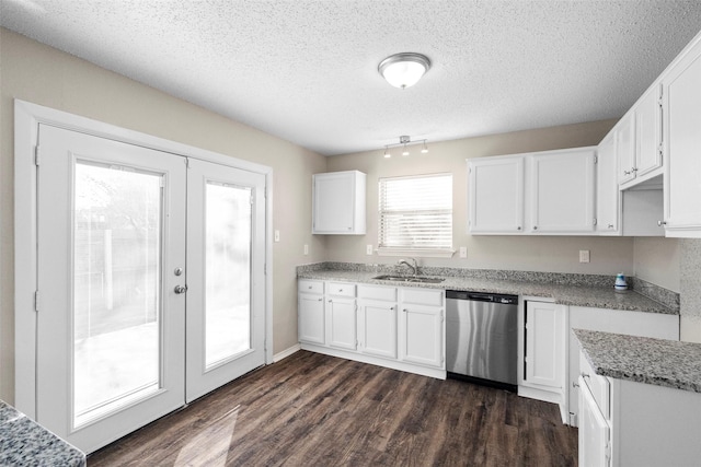 kitchen with dishwasher, dark hardwood / wood-style floors, light stone counters, white cabinets, and french doors