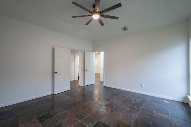 unfurnished room with ceiling fan