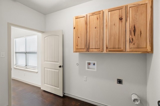 clothes washing area with washer hookup, cabinet space, gas dryer hookup, electric dryer hookup, and baseboards