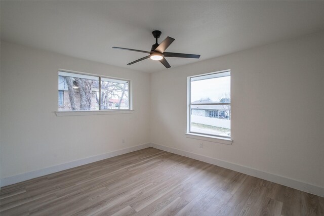 unfurnished living room featuring ceiling fan, high vaulted ceiling, beam ceiling, and light hardwood / wood-style floors