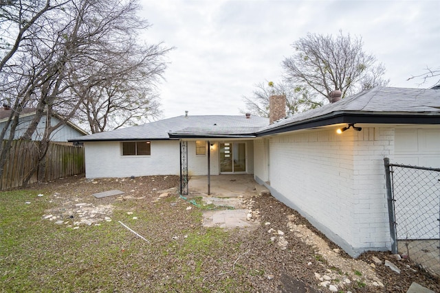 rear view of property featuring a patio area