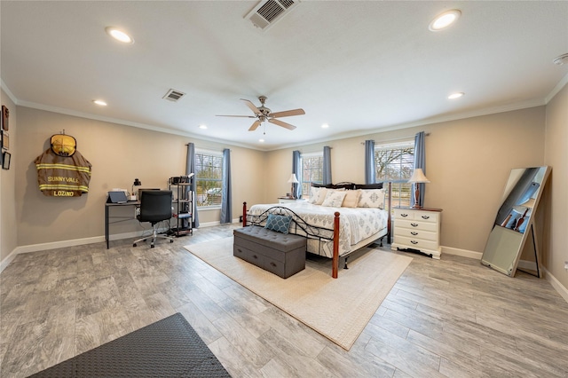 bedroom featuring crown molding, ceiling fan, and light hardwood / wood-style floors