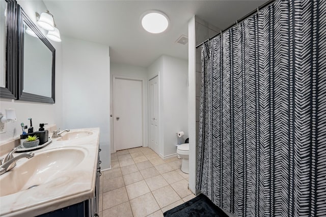 bathroom featuring tile patterned flooring, vanity, toilet, and a shower with shower curtain