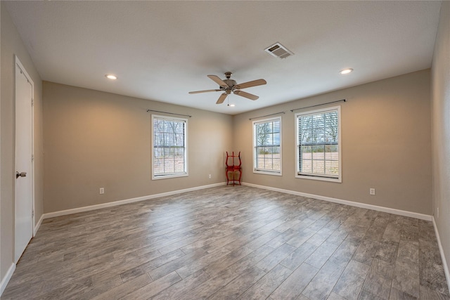 unfurnished room featuring wood-type flooring and ceiling fan