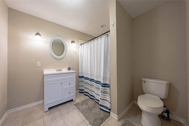 bathroom with vanity, tile patterned flooring, a shower with curtain, and toilet