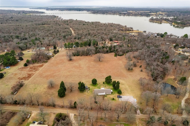 birds eye view of property featuring a rural view and a water view