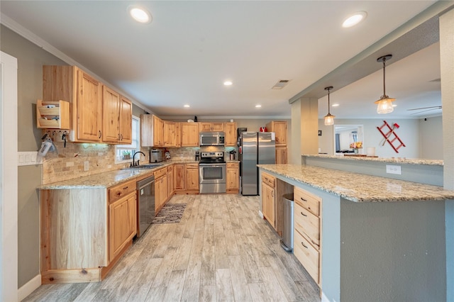 kitchen featuring stainless steel appliances, hanging light fixtures, light stone counters, and decorative backsplash