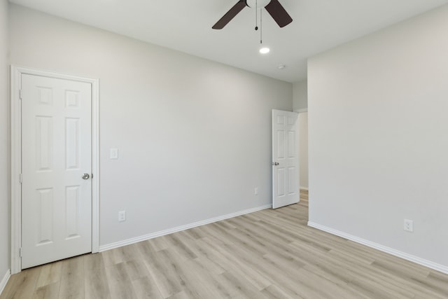 unfurnished room featuring ceiling fan and light hardwood / wood-style flooring