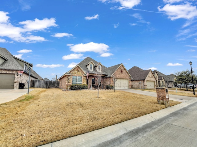 view of front of property with a garage and a front lawn