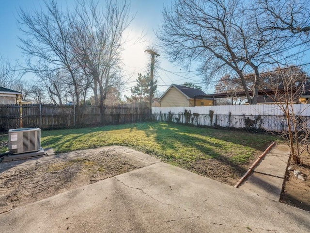 view of yard featuring cooling unit and a patio