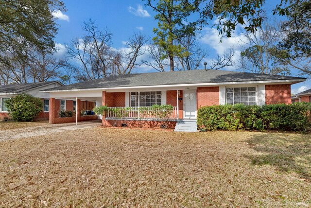 single story home with a carport and a front lawn