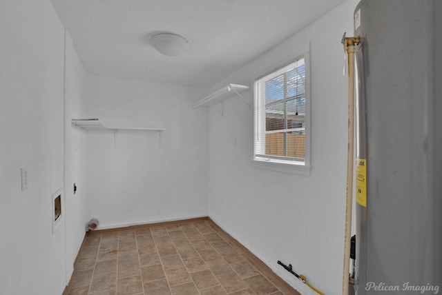 spacious closet featuring water heater