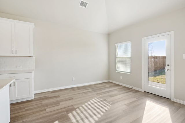 unfurnished dining area featuring light hardwood / wood-style floors