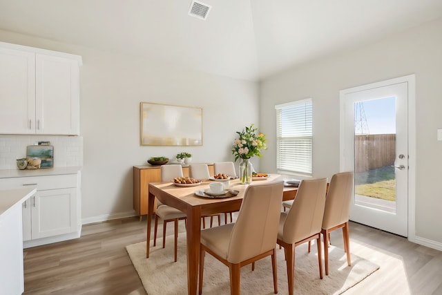 dining space featuring light wood-type flooring